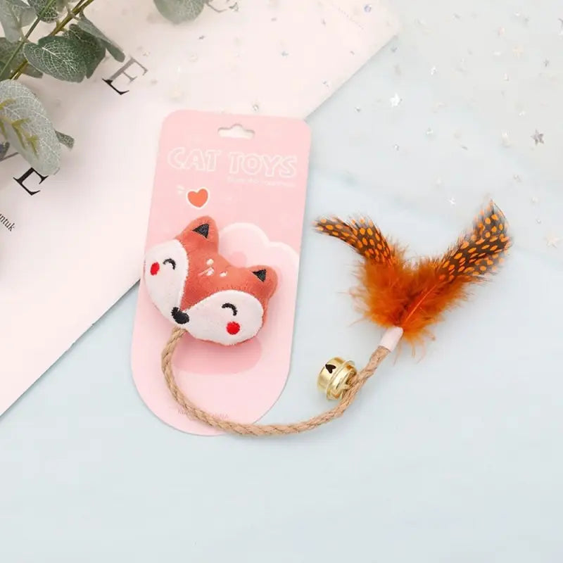 Jouet à mâcher pour chats : Étui rose avec tête de renard et grelot doré