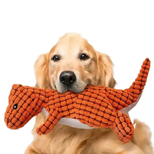 Chien tenant la peluche Original Dinosaur Sound Toy peluche dans sa gueule, mécanique sonore action Transparent Background